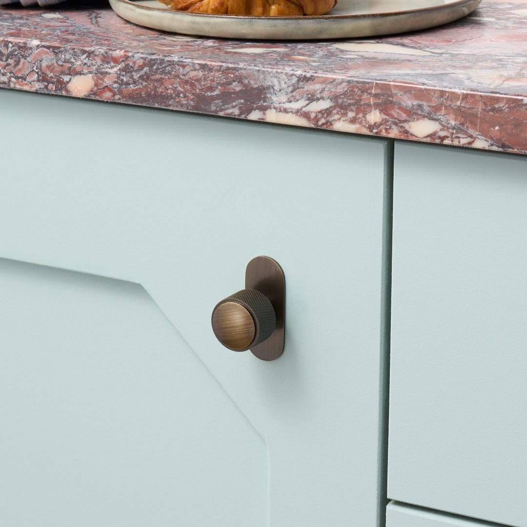 Plank Hardware KEPLER Knurled Button Wall Hook - Antique Brass